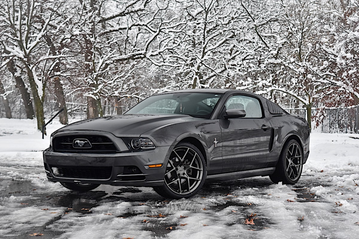 2013 Ford Mustang V6 wheels with American Racing Crossfire rims.
