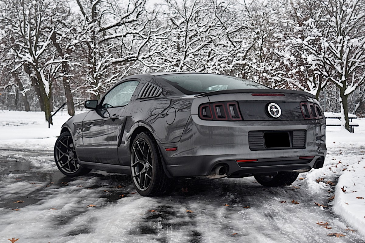 2013 Ford Mustang V6 wheels with American Racing Crossfire rims.