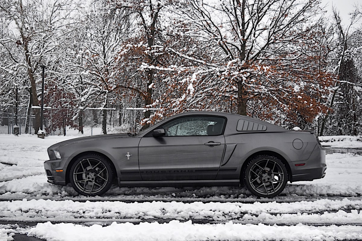 2013 Ford Mustang V6 wheels with American Racing Crossfire rims.